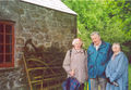 Elizabeth, John and Sady Johnston, standing outside the old forge, they can remember going there as children